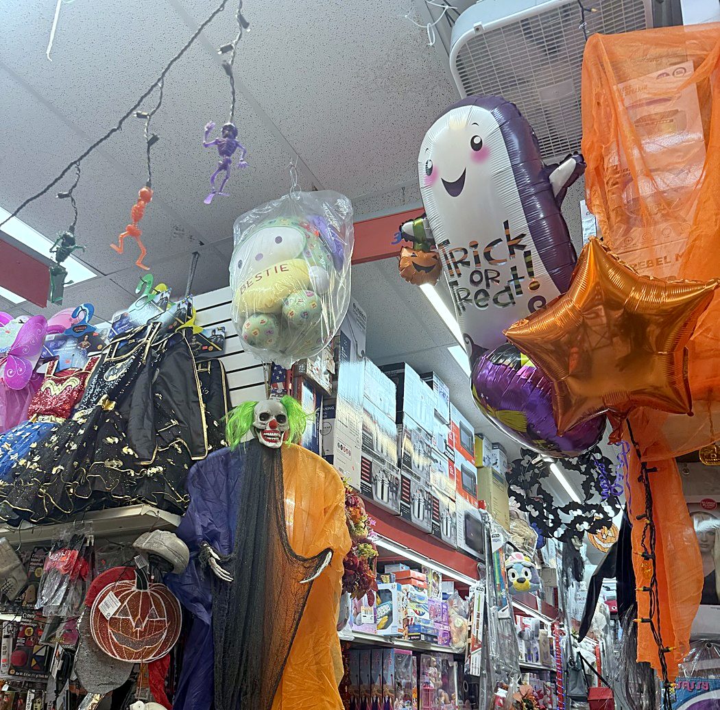 Costumes and balloons in the window